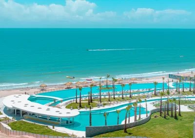 Aerial view of the resort pool complex beside Sandy Beach